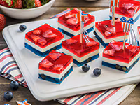 Red, White & Blue Gelatin Squares by LA LECHERA, layered with red and blue gelatin, sweetened condensed milk, with fruits 